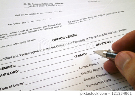 Filling an office lease form 121534961