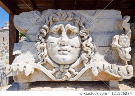 A stone carved Medusa head at the Temple of Apollo at Didyma in Didim A stone carved Medusa head at the Temple of Apollo at Didyma in Didim 121536284