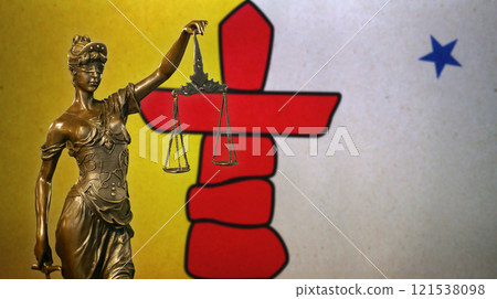 Lady Justice before a flag of Nunavut Lady Justice before a flag of Nunavut 121538098