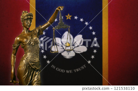 Lady Justice before a flag of Mississippi 121538110