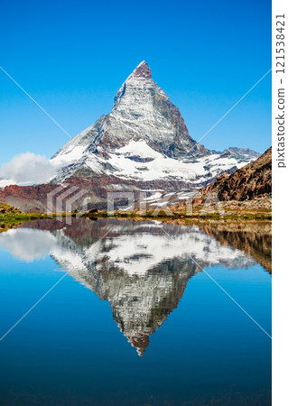 Riffelsee lake and Matterhorn, Switzerland 121538421