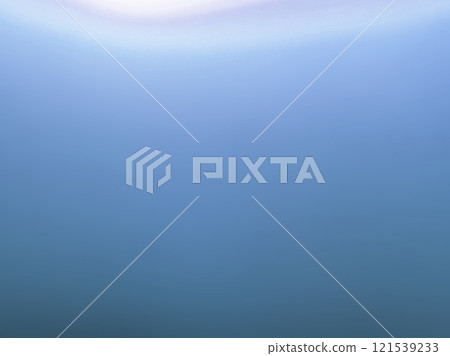 A photo of the surface of water with light shining from above - Gradient 121539233