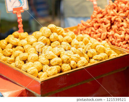 Street food in a Thai market. Fried sausages and meatballs for sale. Street food in a Thai market. Fried sausages and meatballs for sale. 121539521