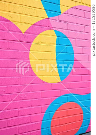 Modern street art, bright graffiti on a brick wall with bright colors and geometric shapes, figures, pop art style.	 121539586