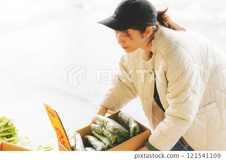 A young female sales clerk arranging products at a traditional fruit and vegetable store. (Photo courtesy of Nuttari Terrace Shopping Arcade) A young female sales clerk arranging products at a traditional fruit and vegetable store. (Photo courtesy of Nuttari Terrace Shopping Arcade) 121541109