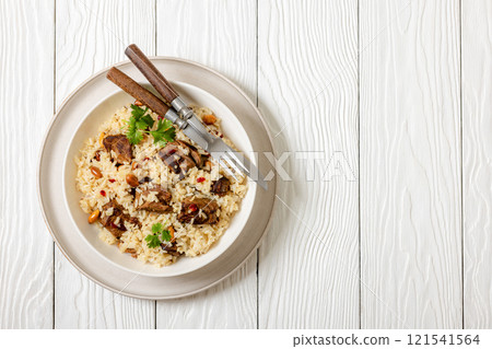 beef and rice in white bowl, top view beef and rice in white bowl, top view 121541564