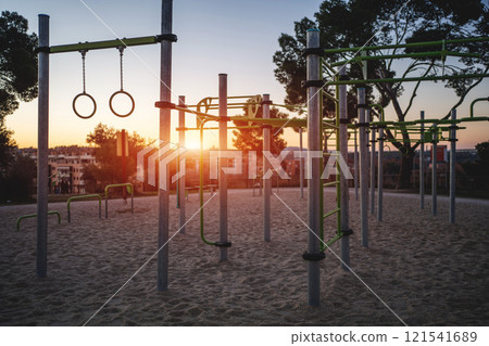 street fitness park for workout and calisthenics area, sport equipment with bars for push and pull ups, healthy lifestyle concept 121541689