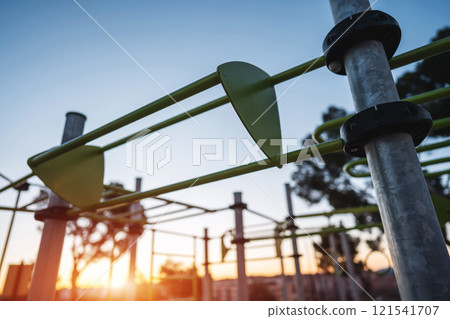 street fitness park for workout and calisthenics area, sport equipment with bars for push and pull ups, healthy lifestyle concept 121541707