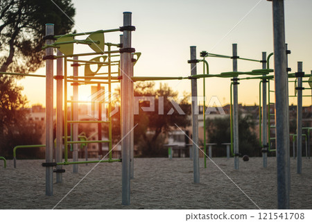 street fitness park for workout and calisthenics area, sport equipment with bars for push and pull ups, healthy lifestyle concept street fitness park for workout and calisthenics area, sport equipment with bars for push and pull ups, healthy lifestyle concept 121541708