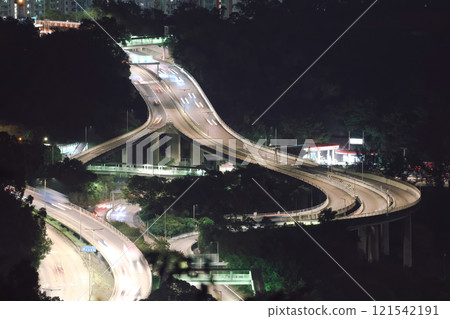 Dec 24 2024 Illuminated Highway Interchange with Nighttime City Surroundings Dec 24 2024 Illuminated Highway Interchange with Nighttime City Surroundings 121542191