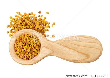 Bee pollen grains in wooden spoon isolated on white background. Top view. Flat lay Bee pollen grains in wooden spoon isolated on white background. Top view. Flat lay 121543666