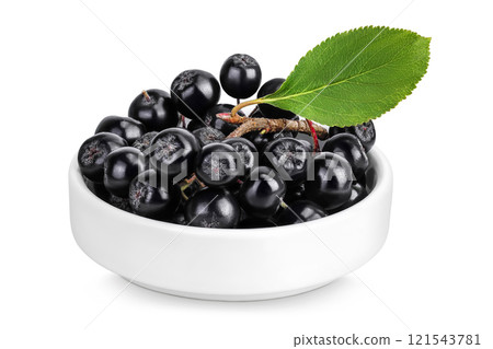Chokeberry in ceramic bowl isolated on white background. Black aronia. Chokeberry in ceramic bowl isolated on white background. Black aronia. 121543781