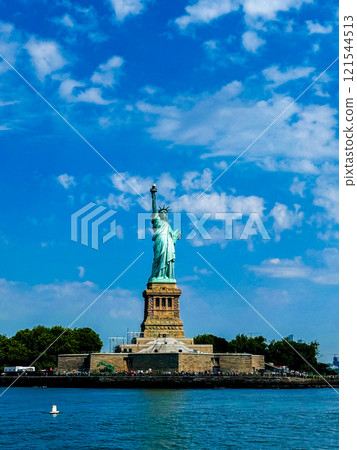 A panoramic view of the Statue of Liberty on Liberty Island from the sea, including the pedestal. 121544513
