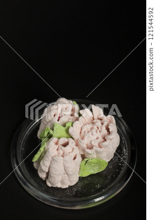 Marshmallow tulips. Zephyr flowers. Sprinkled with powdered sugar. Marshmallow tulips. Zephyr flowers. Sprinkled with powdered sugar. 121544592
