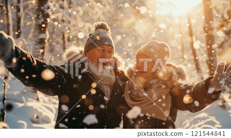 Retirees spend time in winter forest 121544841