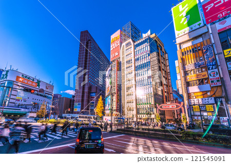Tokyo cityscape in Japan. A ray of hope. Sunlight reflecting off the windows... Kabukicho bustling with foreign tourists. Towards a new era = 29th Tokyo cityscape in Japan. A ray of hope. Sunlight reflecting off the windows... Kabukicho bustling with foreign tourists. Towards a new era = 29th 121545091