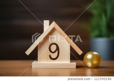 Resting on the table's surface, a tiny wooden house embodies the concepts of homeownership, construction efforts, and the financial obligations related to mortgages. Created with generative AI tools 121545240