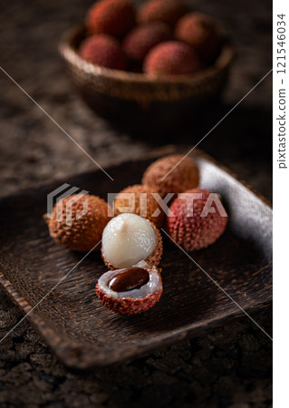 Ripe lychees with their textured skin 121546034