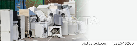 Pile of Broken Household Appliances at a Recycling Center 121546269