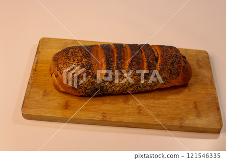 Golden-brown, fragrant poppy seed bread, showcasing its beautiful texture 121546335