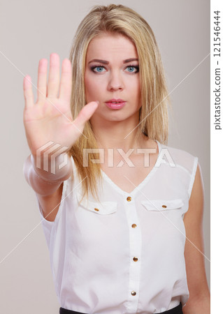 Girl showing stop hand sign gesture. 121546444