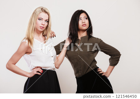 Two fashion women caucasian and african 121546450