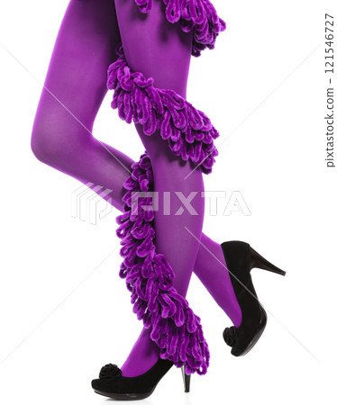Woman long legs and purple stockings isolated 121546727