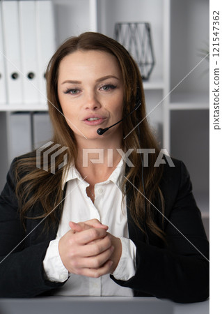 A seasoned business professional deeply engaged in effective remote communication practices that enhance productivity and collaboration, navigating various interactions through technology 121547362