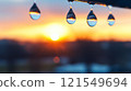 Water Droplets Reflecting Sunset  121549694