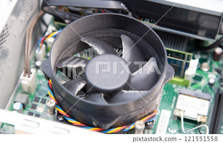 Dust and dirt on the CPU cooling fan of a computer Dust and dirt on the CPU cooling fan of a computer 121551558