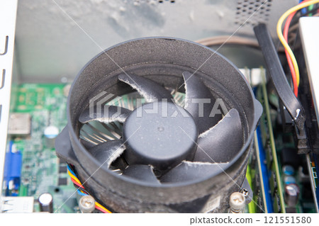 Dust and dirt on the CPU cooling fan of a computer Dust and dirt on the CPU cooling fan of a computer 121551580