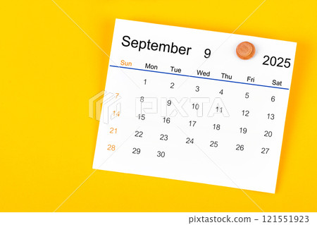 September 2025 and wooden push pin on yellow. September 2025 and wooden push pin on yellow. 121551923