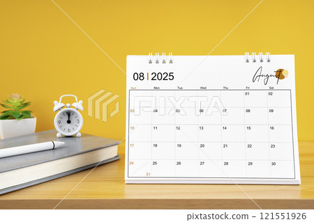 August desk calendar for 2025 year on work table with yellow. August desk calendar for 2025 year on work table with yellow. 121551926