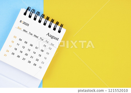 August 2025, Monthly desk calendar for 2025 year on yellow and blue background. 121552010