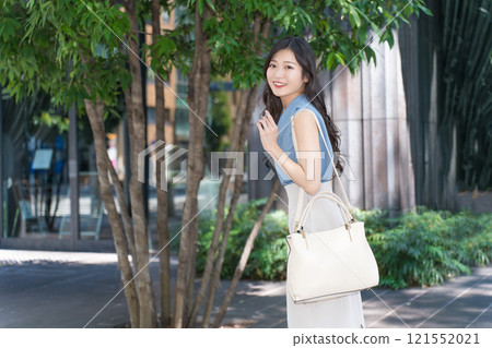businesswoman walking in office 121552021