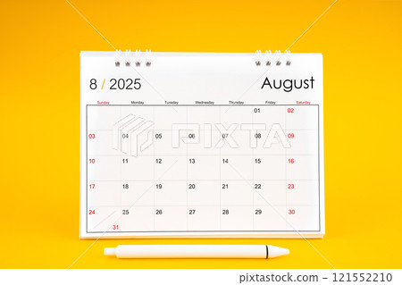 August 2025, Monthly desk calendar for 2025 year and pen on yellow background. August 2025, Monthly desk calendar for 2025 year and pen on yellow background. 121552210