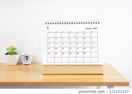 January 2025, Monthly desk calendar for 2025 year on wooden table. 121552257