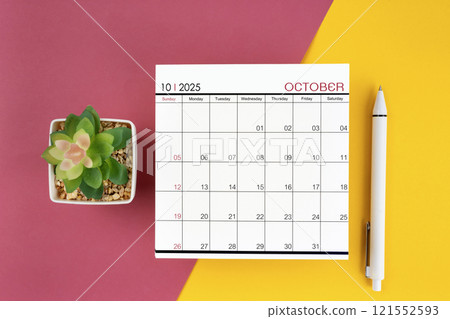 White calendar for October 2025 and pen on beautiful background. 121552593