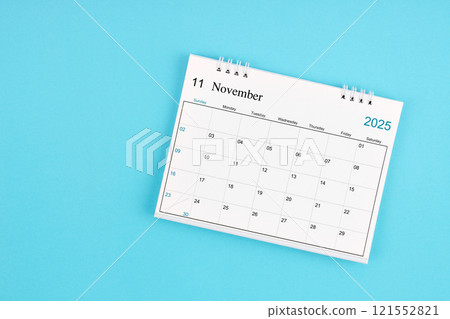 November 2025, Monthly desk calendar for 2025 year on blue background. 121552821