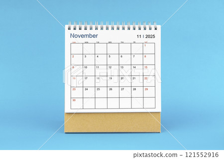 November 2025, Monthly desk calendar for 2025 year on Blue background. 121552916