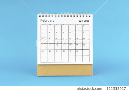 February 2025, Monthly desk calendar for 2025 year on Blue background. 121552917