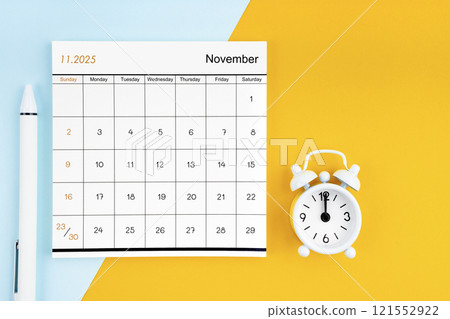 November 2025 Monthly calendar for 2025 year with pen on yellow and blue background. November 2025 Monthly calendar for 2025 year with pen on yellow and blue background. 121552922