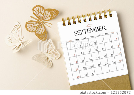 September 2025 desk calendar for the organizer to plan and reminder and butterfly paper on yellow. 121552972