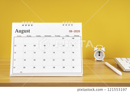 August 2025, Monthly desk calendar for 2025 year on wooden table. 121553197