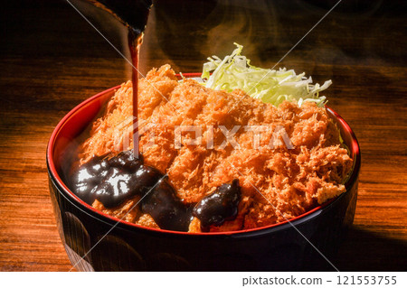 Pouring miso sauce on katsudon 121553755