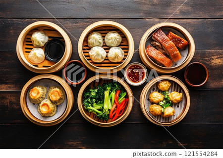 Vibrant colors and intricate textures fill the scene in a top view of a traditional Chinese meal 121554284
