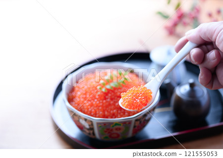 Salmon roe served on a plate 121555053