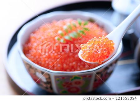Salmon roe served on a plate 121555054