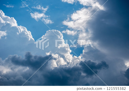 The contrast between the blue sky and the impressive clouds 121555382