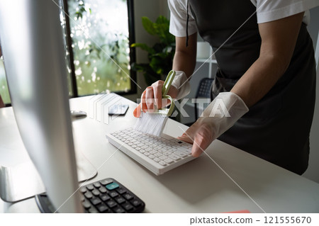 Person Cleaning Computer Keyboard with Brush in Modern Office Environment for Hygiene and Maintenance Person Cleaning Computer Keyboard with Brush in Modern Office Environment for Hygiene and Maintenance 121555670